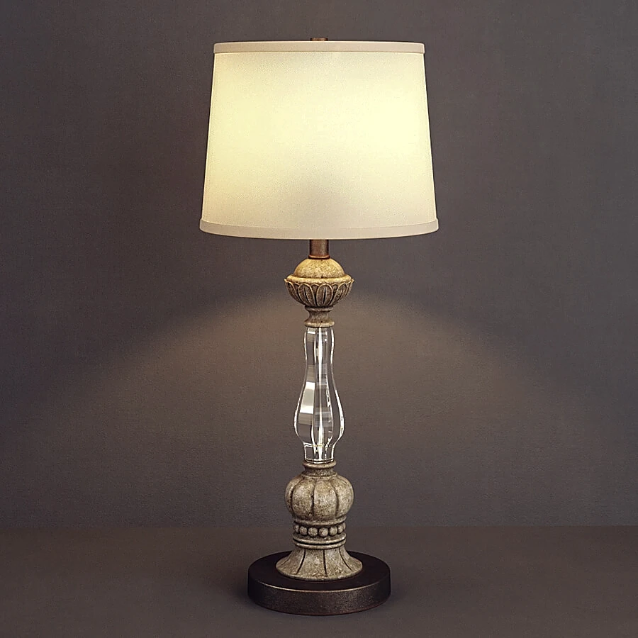 Table lamp with ornate base and clear column