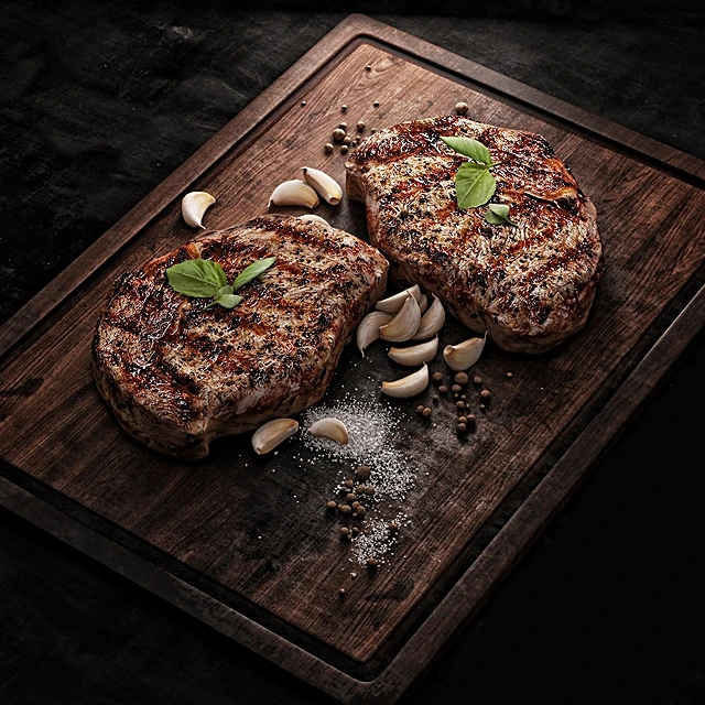 Food Presentation with Grilled Steaks and Garlic