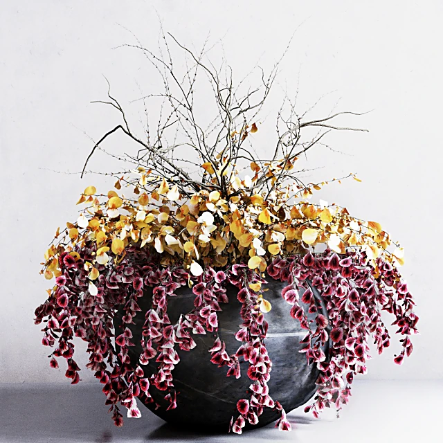 Vase of flowers with cascading foliage