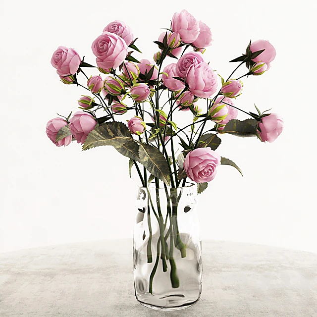 Roses bouquet with pink roses and clear glass vase